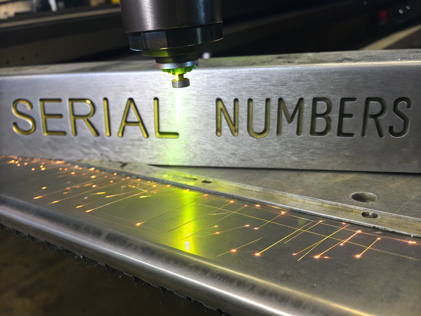 Automotive engine component with laser-etched serial numbers
